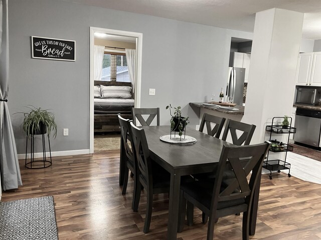 430 NW 2nd Ave, Minot, ND 58703 - dining space featuring wood finished floors and baseboards