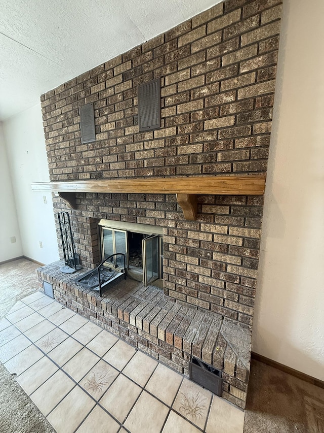 619 25th Ave, Minot, ND 58703 - detailed view of a fireplace, carpet flooring, a textured ceiling, and baseboards
