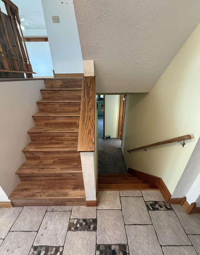 619 25th Ave, Minot, ND 58703 - stairs with baseboards and ceiling fan
