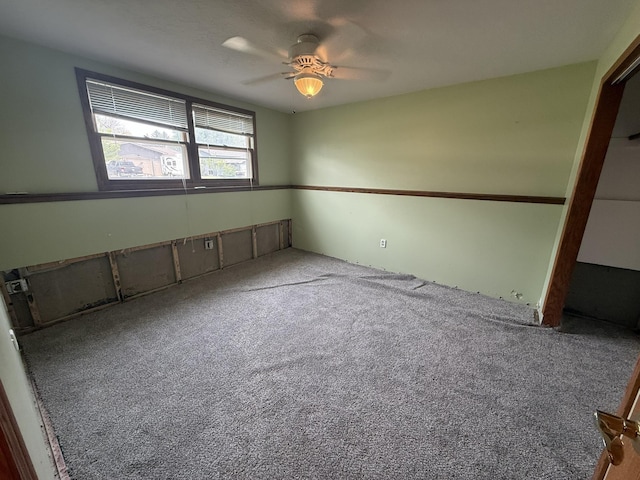 619 25th Ave, Minot, ND 58703 - unfurnished room featuring a ceiling fan and carpet