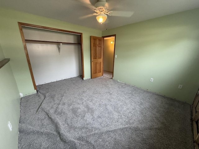 619 25th Ave, Minot, ND 58703 - unfurnished bedroom with carpet floors, a closet, and ceiling fan