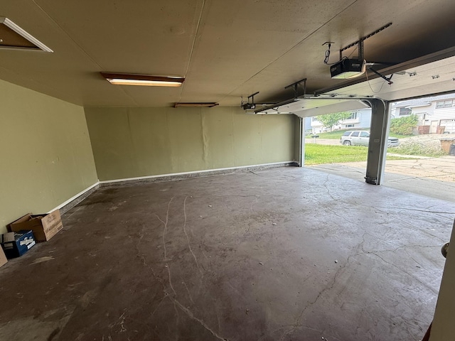619 25th Ave, Minot, ND 58703 - garage featuring a garage door opener