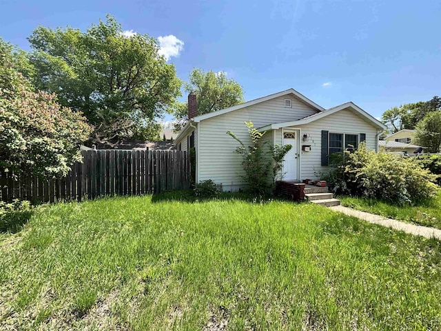 1107 SE 2nd St, Minot, ND 58701 - view of front of home with a chimney