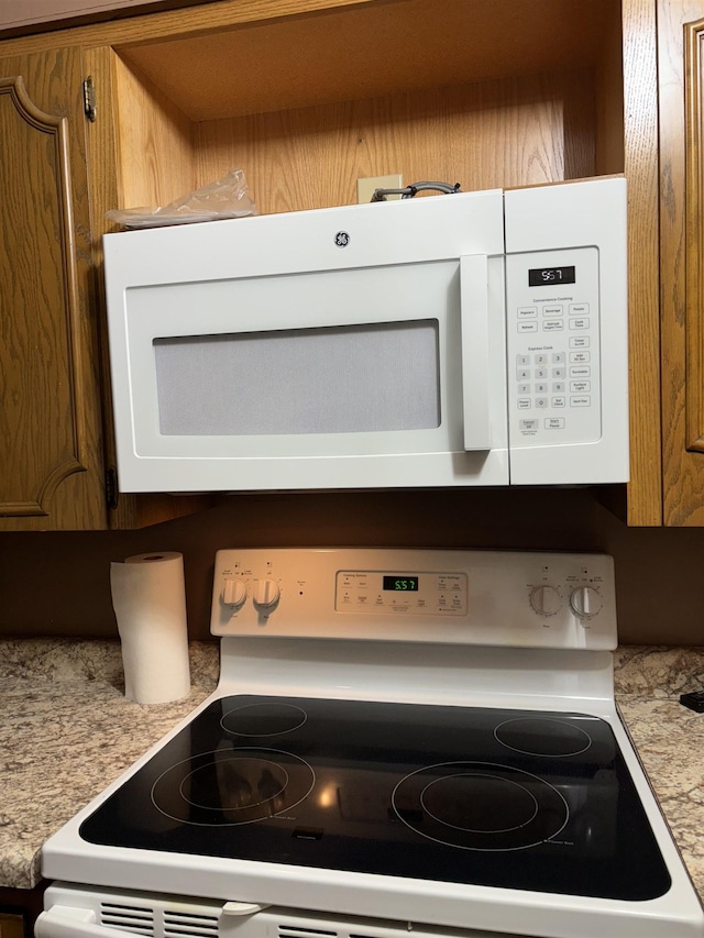 1107 SE 2nd St, Minot, ND 58701 - kitchen view of white appliances and light countertops