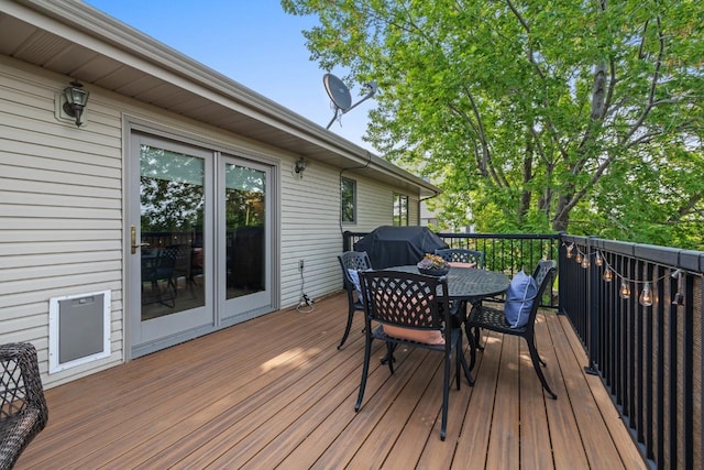 2509 11th Ave, Minot, ND 58703 - wooden deck featuring outdoor dining area