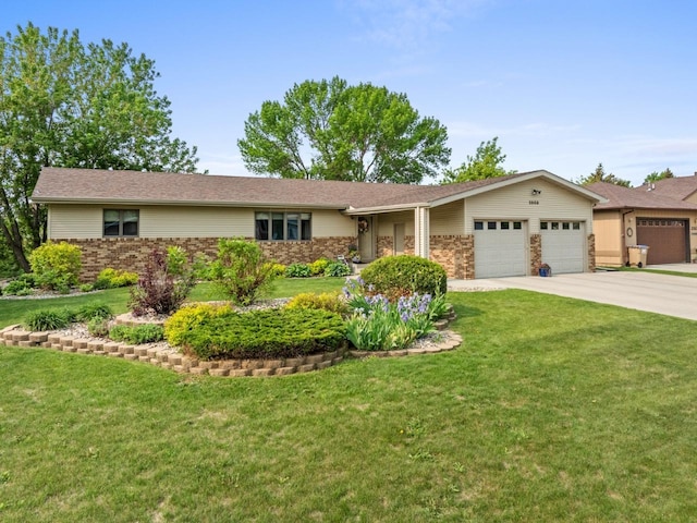 2509 11th Ave, Minot, ND 58703 - ranch-style house featuring an attached garage, driveway, a front lawn, and brick siding