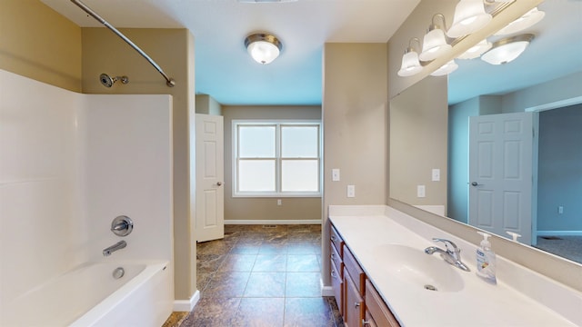 2947 8th St, Minot, ND 58703 - full bathroom featuring shower / tub combination, vanity, baseboards, and tile patterned flooring