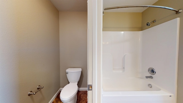 2947 8th St, Minot, ND 58703 - bathroom with toilet, tub / shower combination, and baseboards