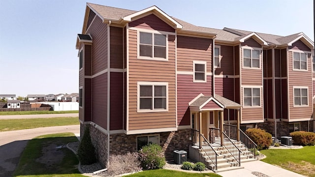 2947 8th St, Minot, ND 58703 - multi unit property with stone siding and cooling unit