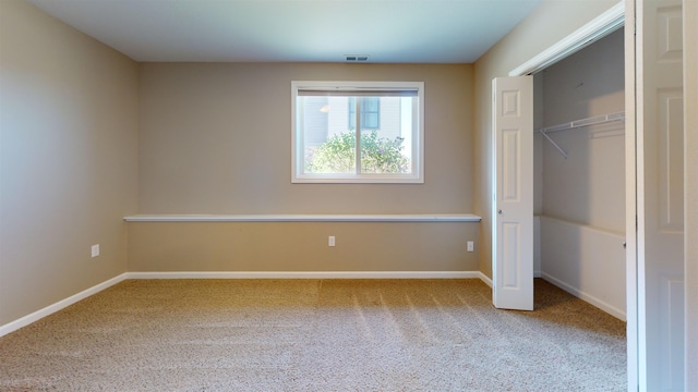 2947 8th St, Minot, ND 58703 - unfurnished bedroom featuring carpet floors, baseboards, and a closet
