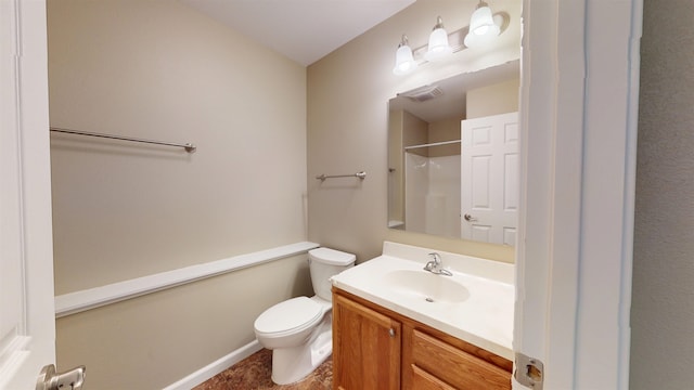 2947 8th St, Minot, ND 58703 - bathroom with vanity, toilet, a shower, and baseboards