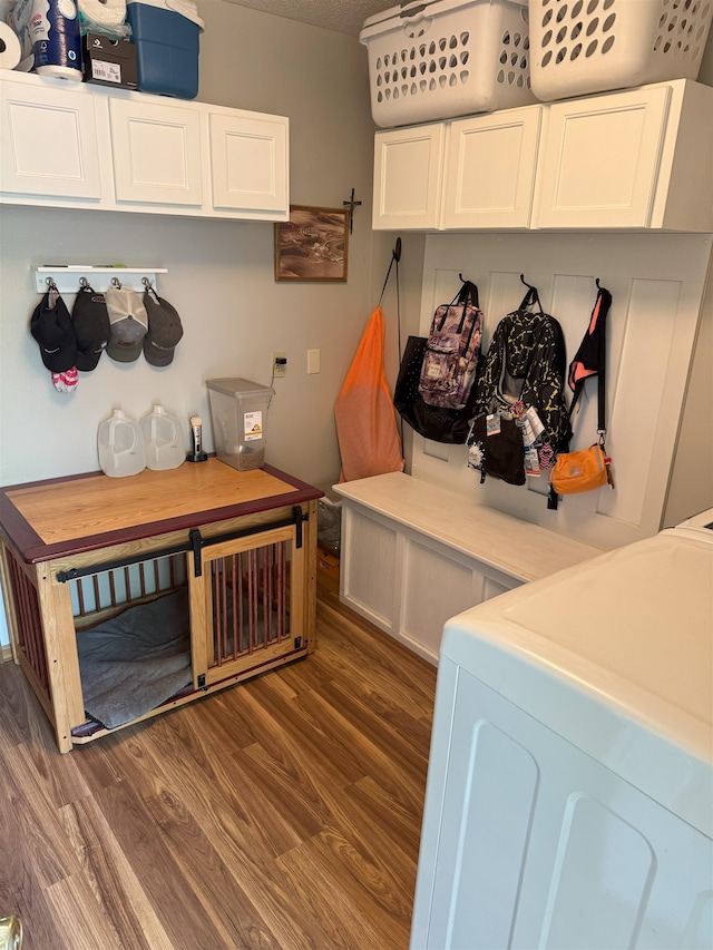 919 9th St, Minot, ND 58703 - mudroom with wood finished floors and washing machine and dryer