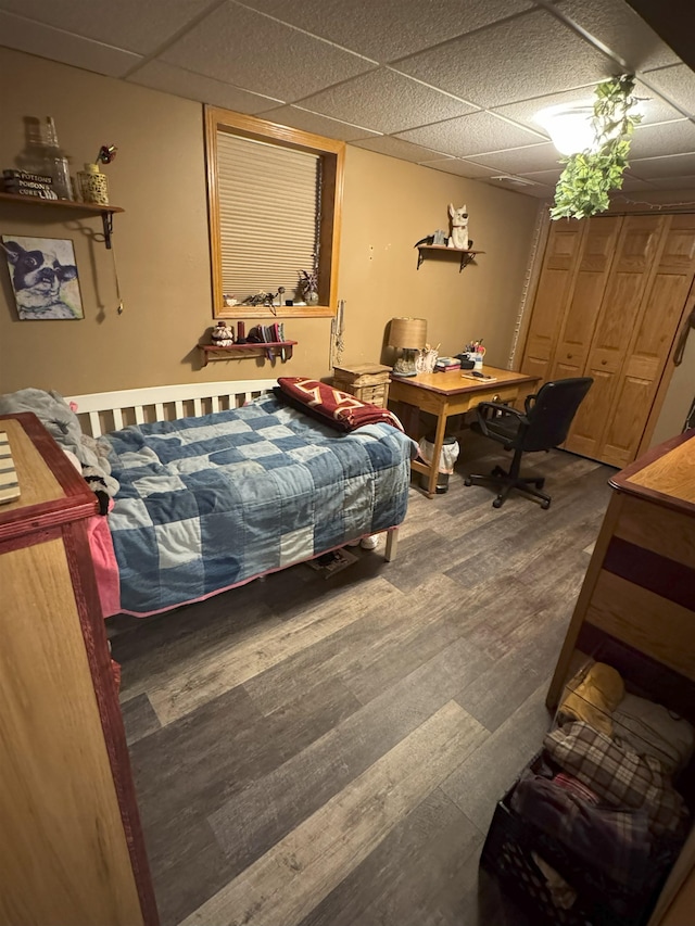 919 9th St, Minot, ND 58703 - bedroom with a paneled ceiling and wood finished floors