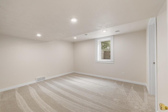 901 3rd St, Minot, ND 58701 - basement featuring light carpet, baseboards, and recessed lighting