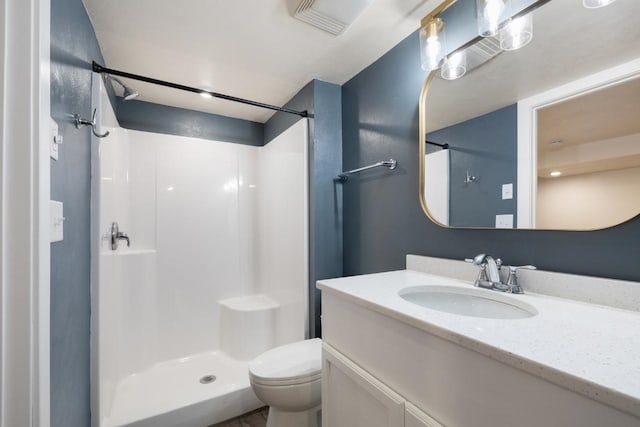 901 3rd St, Minot, ND 58701 - bathroom featuring a shower, toilet, and vanity