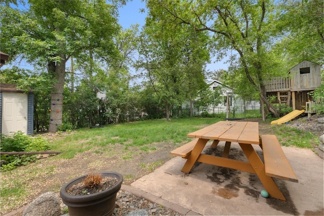 901 3rd St, Minot, ND 58701 - fenced yard with outdoor dining space and a patio area