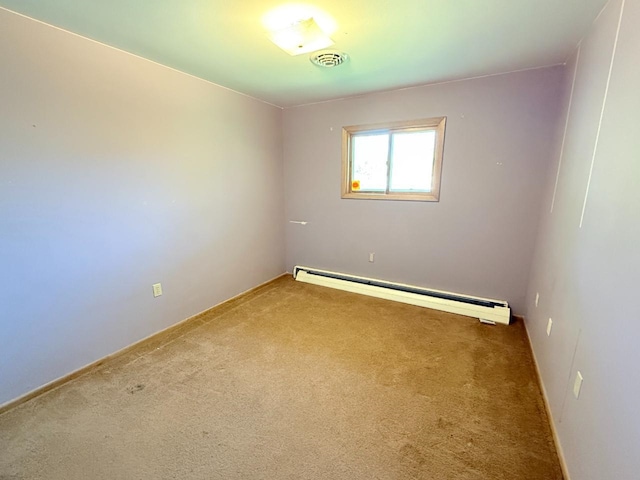 30 1st St, Sawyer, ND 58781 - carpeted empty room with baseboard heating and baseboards