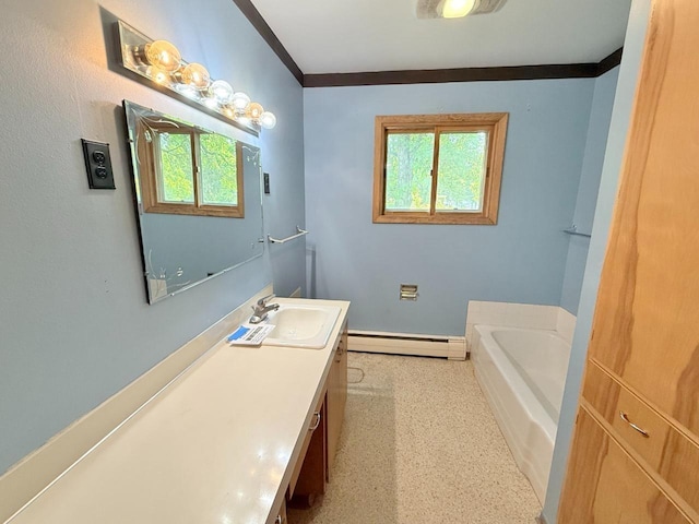 30 1st St, Sawyer, ND 58781 - bathroom with baseboard heating, vanity, a bath, baseboards, and ornamental molding