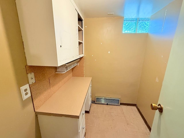 30 1st St, Sawyer, ND 58781 - kitchen featuring white cabinets, backsplash, light flooring, light countertops, and open shelves