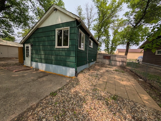 2704 SE 9th Ave, Minot, ND 58701 - view of home's exterior featuring a patio