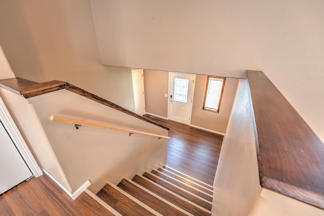 3421 8th St, Minot, ND 58703 - staircase with wood finished floors and baseboards
