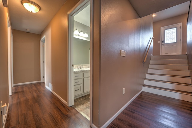 3421 8th St, Minot, ND 58703 - stairs featuring wood finished floors and baseboards