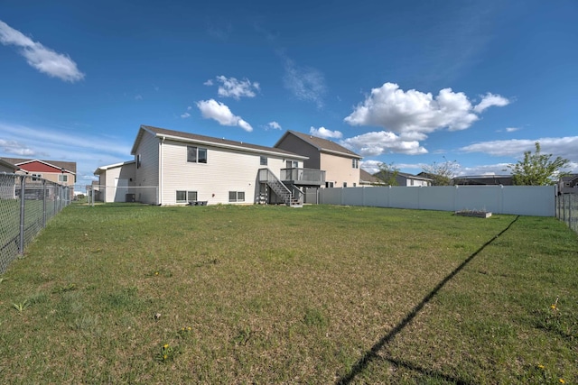 3421 8th St, Minot, ND 58703 - rear view of property featuring stairs and a deck