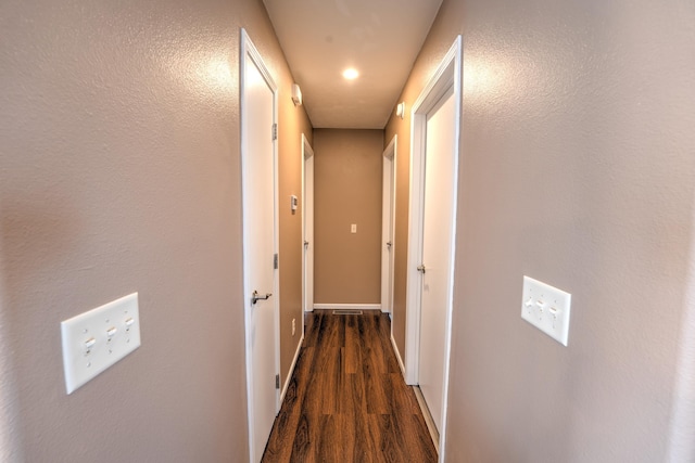 3421 8th St, Minot, ND 58703 - hall featuring wood finished floors and baseboards