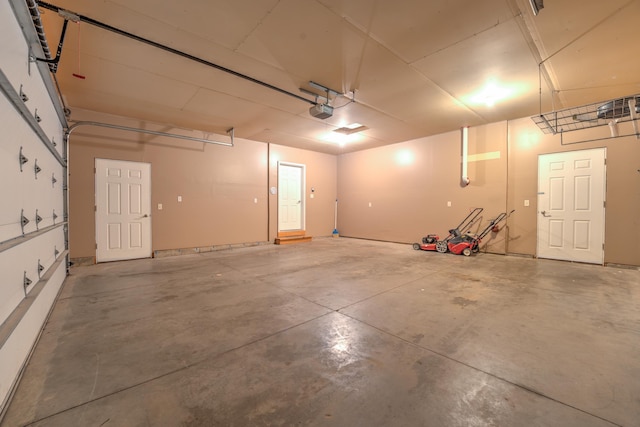 3421 8th St, Minot, ND 58703 - garage featuring a garage door opener