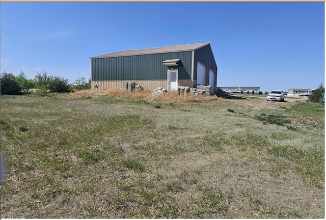 4944 14f St, Garrison, ND 58540 - view of side of property featuring an outbuilding, a garage, and a pole building