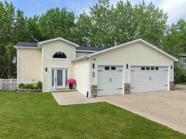 1321 Golden Valley Ln, Minot, ND 58703 - view of front of home with stucco siding, a garage, concrete driveway, stone siding, and roof with shingles