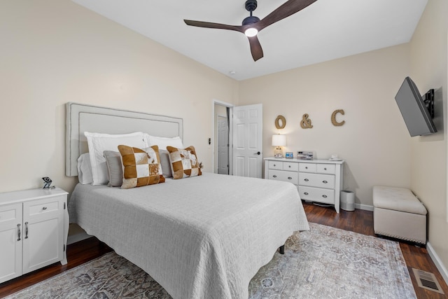 1321 Golden Valley Ln, Minot, ND 58703 - bedroom featuring dark wood-style flooring, baseboards, and ceiling fan