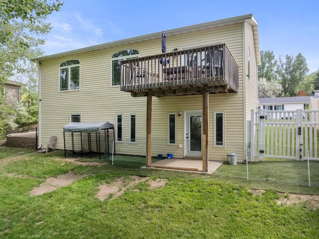 1321 Golden Valley Ln, Minot, ND 58703 - rear view of property with a wooden deck