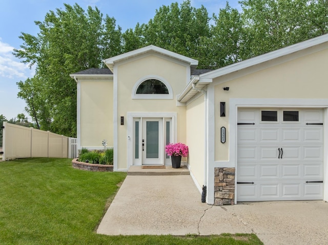1321 Golden Valley Ln, Minot, ND 58703 - view of front of house featuring stucco siding and a garage