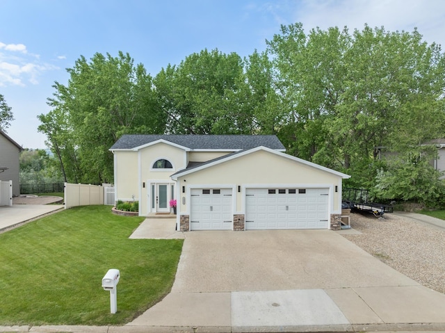 1321 Golden Valley Ln, Minot, ND 58703 - traditional-style home with stone siding, driveway, an attached garage, and stucco siding
