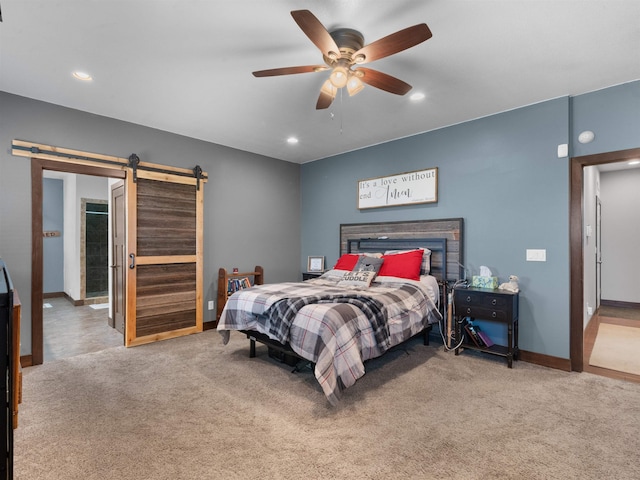 6125 11th Ave, Minot, ND 58701 - carpeted bedroom with a barn door, recessed lighting, baseboards, and a ceiling fan