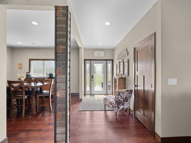 6125 11th Ave, Minot, ND 58701 - entrance foyer with wood finished floors, recessed lighting, and baseboards