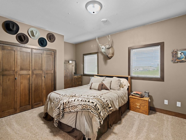6125 11th Ave, Minot, ND 58701 - bedroom with light carpet and baseboards