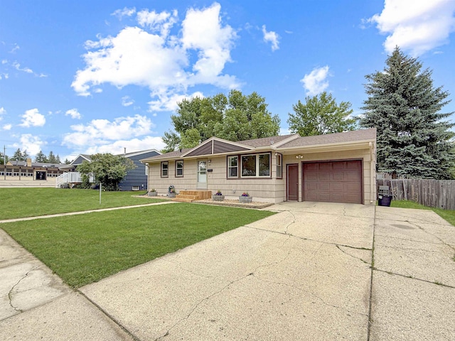 424 26th St, Minot, ND 58703 - ranch-style house with concrete driveway and an attached garage