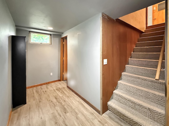 424 26th St, Minot, ND 58703 - stairway featuring wood finished floors and baseboards