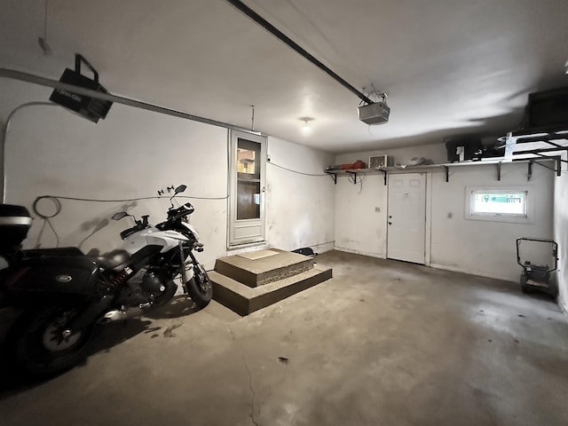 424 26th St, Minot, ND 58703 - garage featuring a garage door opener