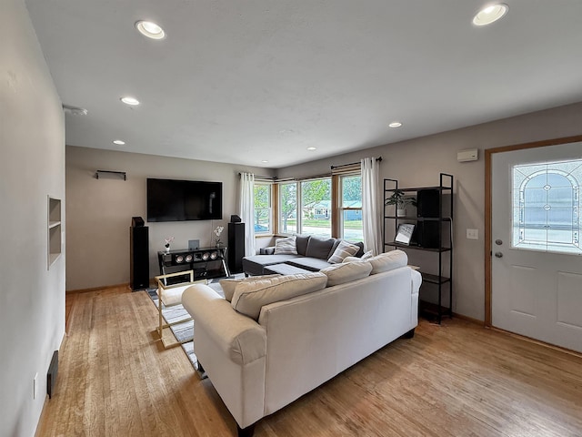 424 26th St, Minot, ND 58703 - living area with light wood-style floors, recessed lighting, and baseboards