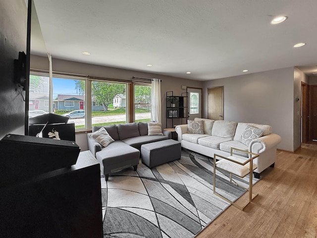 424 26th St, Minot, ND 58703 - living area with light wood-style flooring and recessed lighting