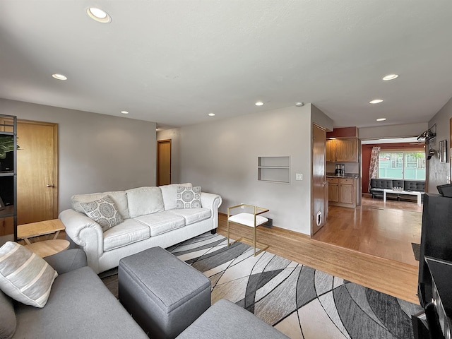 424 26th St, Minot, ND 58703 - living area with recessed lighting and light wood finished floors
