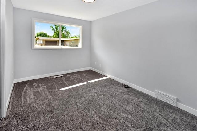 1821 11th St, Minot, ND 58701 - spare room with carpet and baseboards