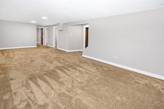 1821 11th St, Minot, ND 58701 - carpeted empty room with baseboards and recessed lighting