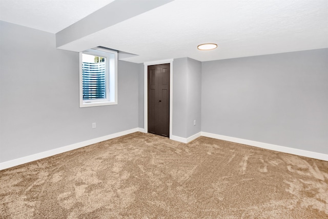 1821 11th St, Minot, ND 58701 - carpeted empty room with baseboards