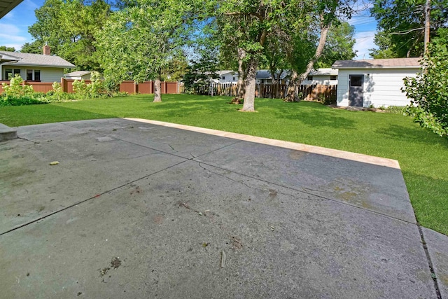 1821 11th St, Minot, ND 58701 - view of patio / terrace with an outbuilding