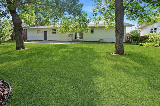 1821 11th St, Minot, ND 58701 - back of house featuring a patio area