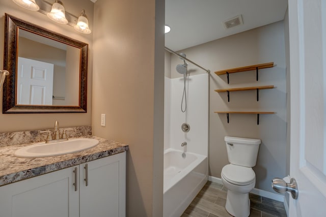 3328 NW 20th Ave, Minot, ND 58703 - bathroom featuring toilet, vanity, shower / tub combination, and baseboards